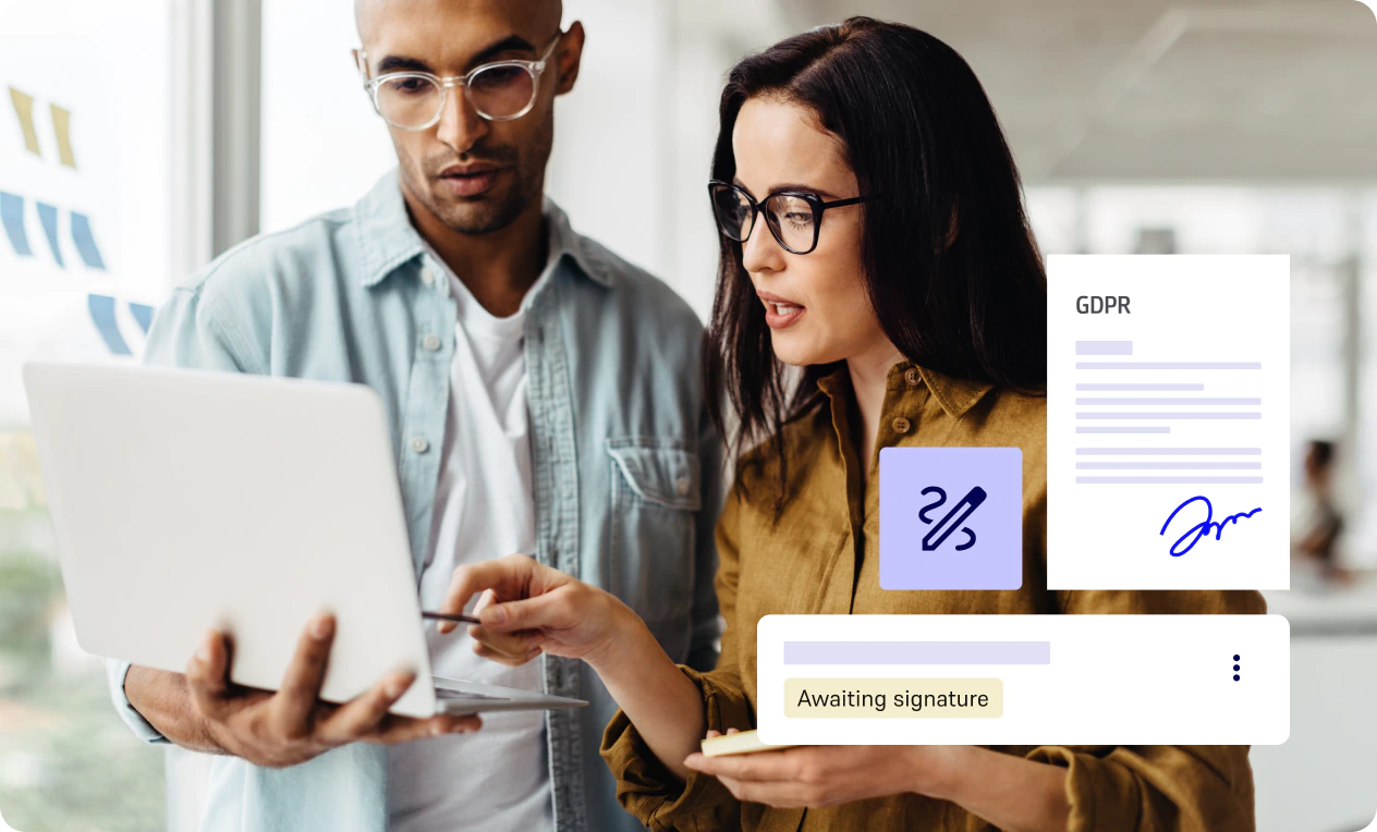Two professionals reviewing a document on a tablet.