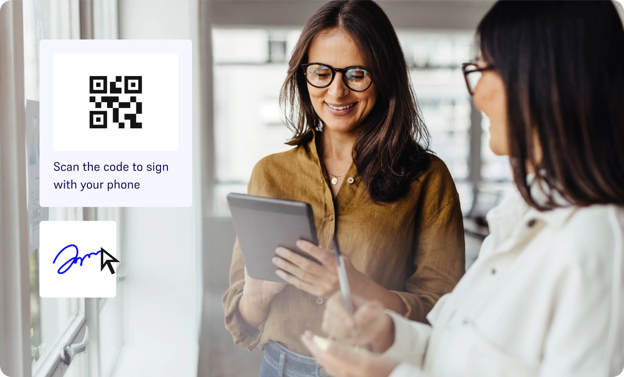Two professionals signing documents electronically on a tablet.
